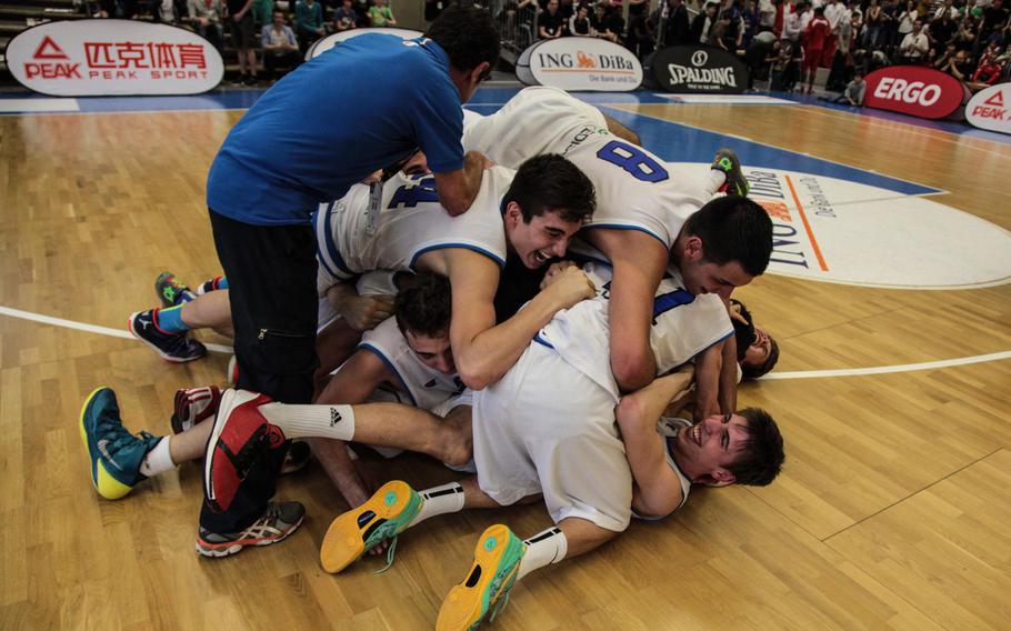 Team Italy celebrates after beating the U.S. 86-73 in the final of the Albert Schweitzer basketball tournament Saturday, April 26, 2014, in Mannheim, Germany.