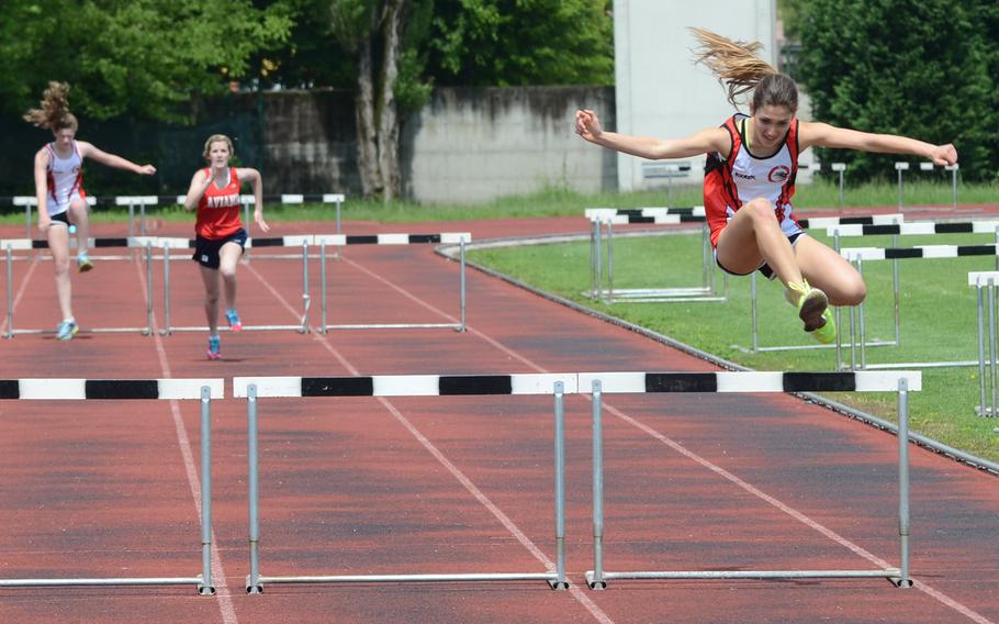 American Overseas School of Rome hurdler Lucrezia Basei clears the final hurdle Saturday, during the second heat of the 300-meter track and field event at Creazzo, Italy. Basei ran 58.93 seconds.
