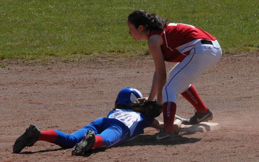 Ramstein's Bailey Loomis slides back into second base before the tag by Kaiserslautern's Megan Thornton in the Royals' 17-7 victory Friday, May 16, 2014, at Kaiserslautern, Germany. 