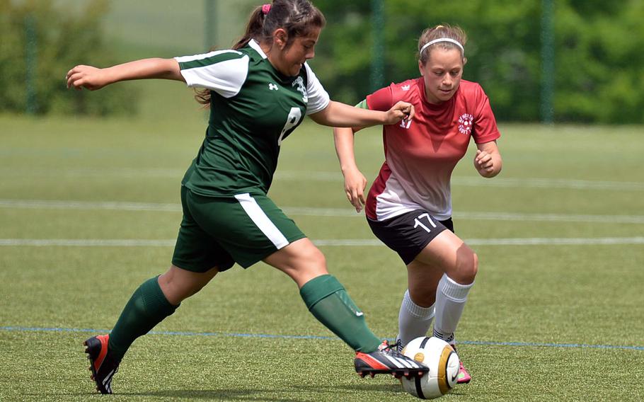 Alconbury's Roni Teti , left, and AFNORTH's Jena Solorzano chase down a ball in a Division II semifinal game at the DODDS-Europe soccer championships in Reichenbach, Germany, Wednesday, May 21, 2014. AFNORTH won 5-4 in overtime and will face Naples in the championship game on Saturday.