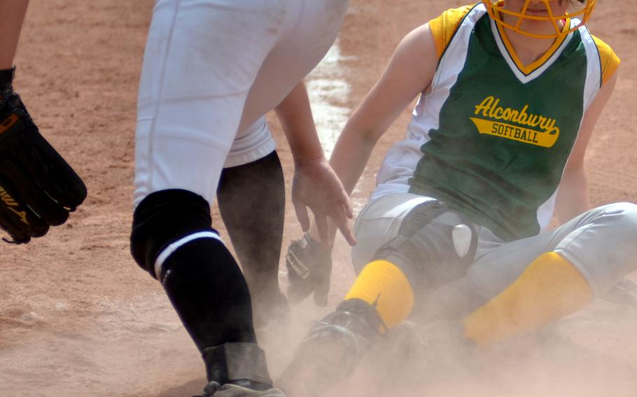 Alconbury senior Caitlin Cash steals home on a pass ball against AFNORTH during the first day of pool play in the DODDS-Europe softball championships in Kaiserslautern, Germany on May 22, 2014.  Alconbury beat AFNORTH 9-7.