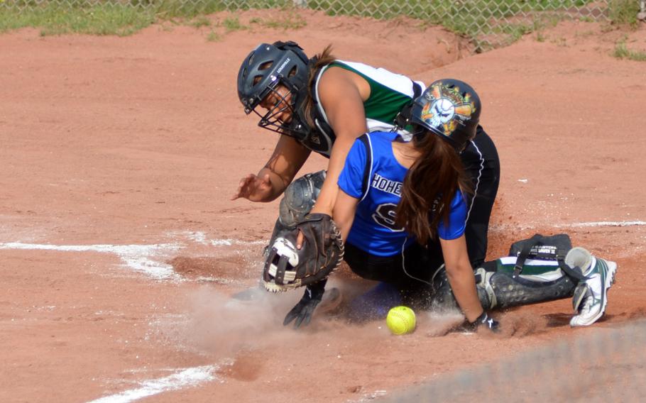 Hohenfels freshman Elexianna Artiaga steals home from Naples catcher Aundrea Hall during the first day of pool play in the DODDS-Europe softball championships in Kaiserslautern, Germany on May 22, 2014.  Naples beat Hohenfels 11-4.