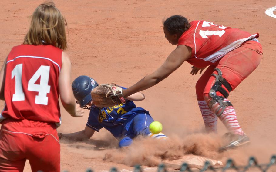 Kaiserslautern's Kourtney Nunnery unsuccessfully tries  to prevent Wiesbaden's Rachel Beville from stealing third base in day one of pool play at the DODDS-Europe softball championships in Kaiserslautern, Germany on May 22, 2014. 