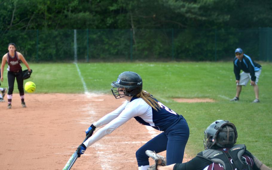 Lakenheath's Jade Julien bunts a ball against Vilseck in day one of pool play at the DODDS-Europe softball championships in Kaiserslautern, Germany on May 22, 2014.  Lakenheath defeated Vilseck 5-3.