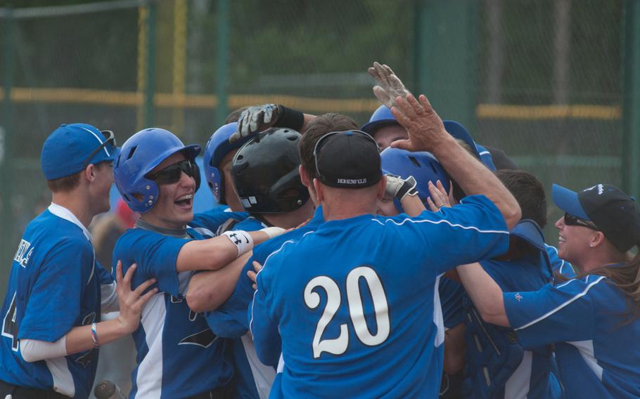 The Hohenfels Tigers celebrate their 11-10 come-from-behind victory against the Bitburg Barons during day one of pool play in the DODDS-Europe Division II baseball tournament at Ramstein, Germany on May 22, 2014. 