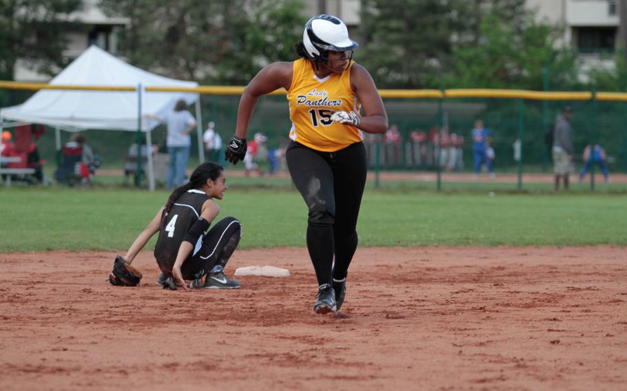 Patch's Breanna Rodriguez-Jeff barrels toward third after blowing through Vilseck's Beth Siatini in the Panther's 9-1 quarterfinal win over the Falcons in the DODDS-Europe softball championships Friday.  