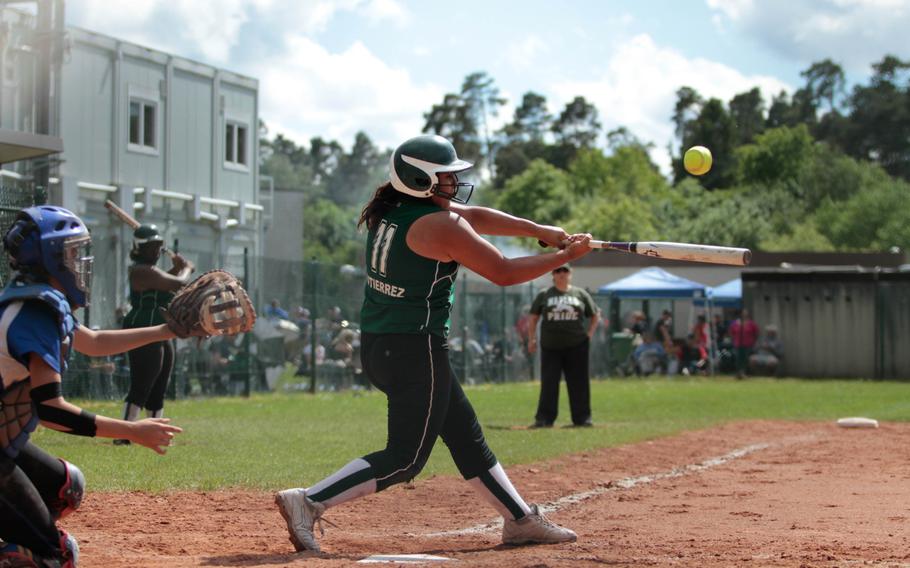Naples' Davina Gutierrez smacks a fly ball in the Wildcats 18-3 drubbing of Ansbach in their quarterfinal matchup Friday, in the DODDS-Europe softball championships in Kaiserslautern, Germany. 