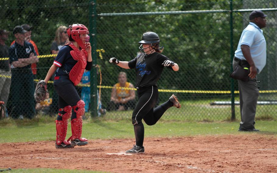 Hohenfels' Mikaela Strange scores a run in the Lions' 10-3 win Friday over Aviano in a quarterfinal game in the DODDS-Europe softball championship at Kaiserslautern, Germany. 
