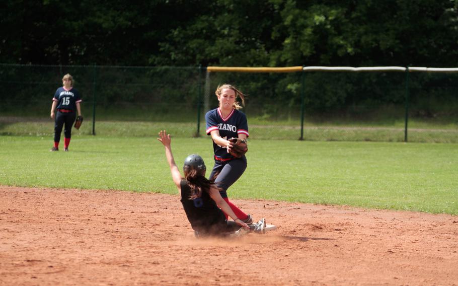 Hohenfels' Leslie Martinez slides into second as Aviano's Lindsey Farrington reaches for the tag. Hohenfels won their quarterfinals matchup in the DODDS-Europe softball championships 10-3. 