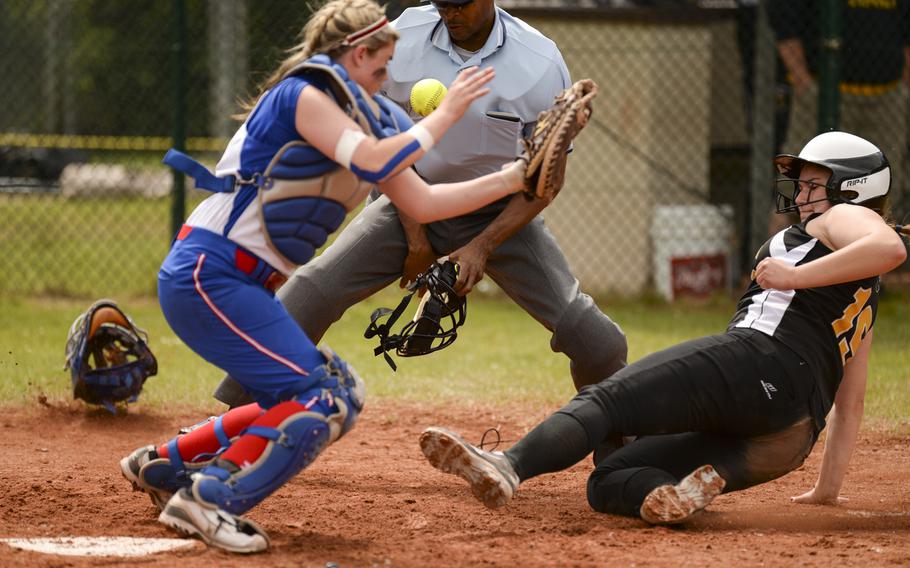Patch's Cossette Puckett slides into home against Ramstein's Kristina Poe on Saturday, May 24, 2014, in the DODDS-Europe Division I championship game at Ramstein, Germany.