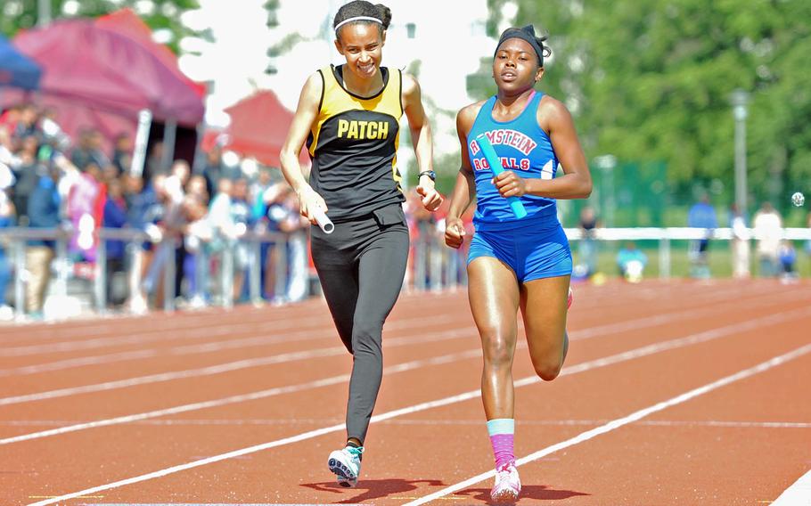 Ramstein anchor D'Myia Thorton, right, races Patch's Julia Lockridge to the finish line of the girls 4x400-meter relay. Thorton and teammates Khalina Polanco, Jewel Beji and Denee Lawrence won in 4 minutes, 12.26 seconds, .06 seconds ahead of Patch.