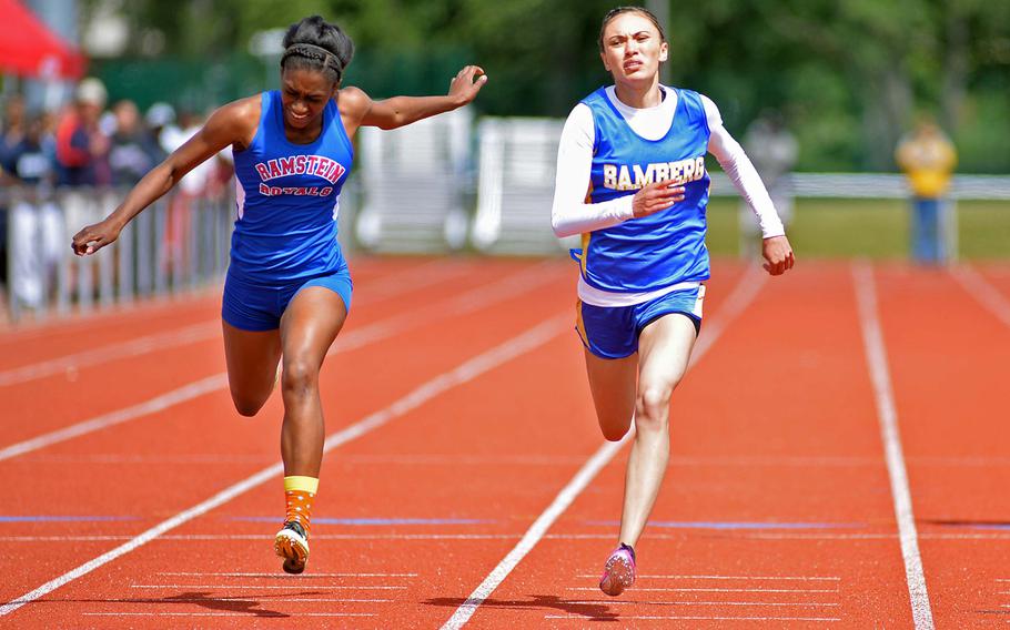 Bamberg's Katie Funcheon, right, won the 200-meter race in 25.74 seconds, beating out Ramstein's Denee Lawrence by .01 second at the DODDS-Europe track and field championships in Kaiserslautern, Germany, Saturday, May 24, 2014.