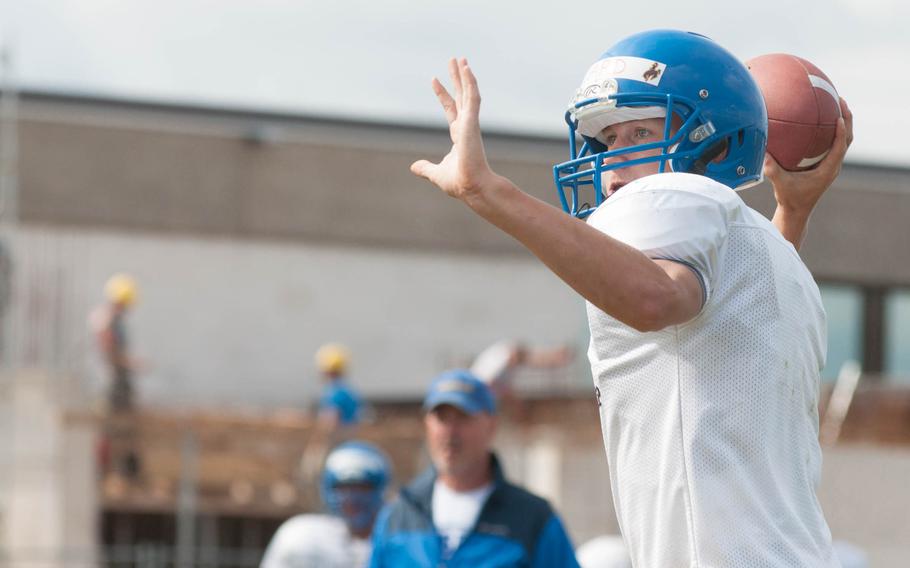 Cougar starting quarterback Bailey Ward looks for an open man during a practice, Aug. 23, 2014. Ward is only one of twelve returning Ansbach players from last year. 