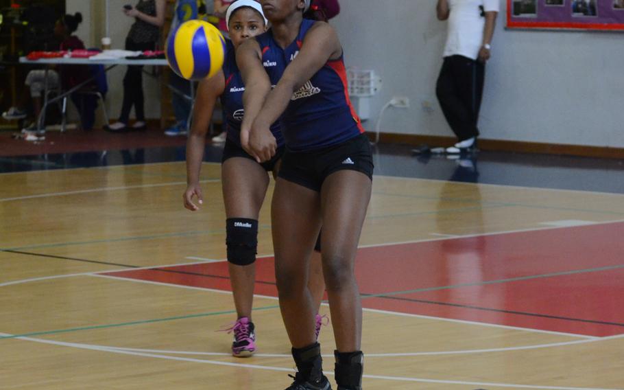 Aviano's Jasmine Cole bumps the ball following a serve from a Vicenza player Saturday during a set of matches at Aviano Air Base, Italy. The Saints won two matches back-to-back, 3-1.
