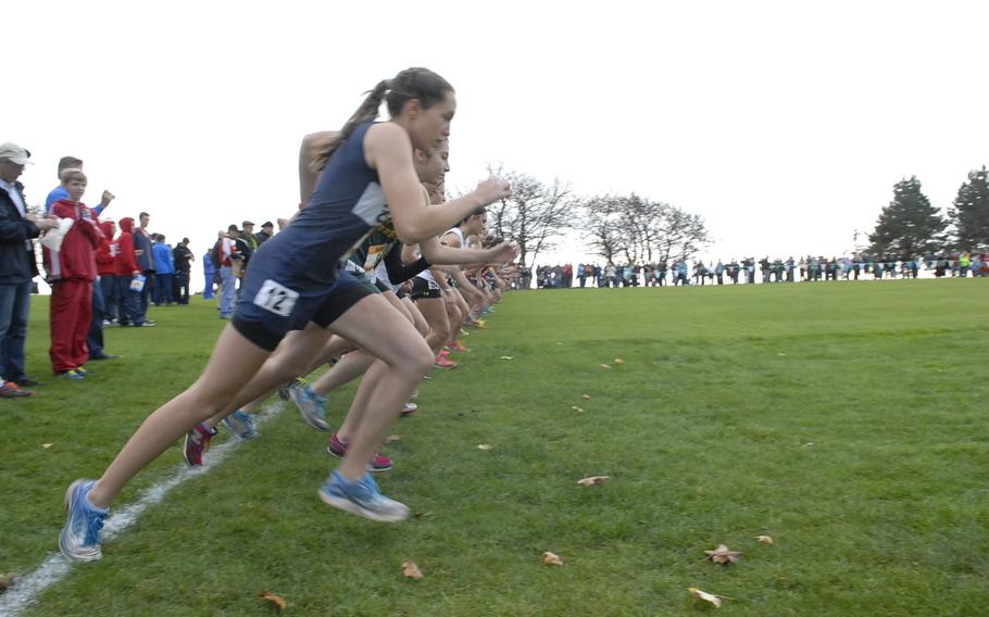 Bitburg's Frances Gatterburg and other runners take off at the start of the girls' race, Oct. 26, 2013, at the DODDS-Europe cross-country championships at Baumholder, Germany.