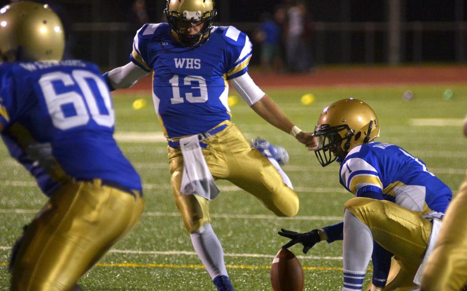 Wiesbaden kicker Eric Arnold attempts an extra point in Friday night's game against the Falcons.  The Warriors eventually beat the Falcons 32-17 despite being down at halftime.