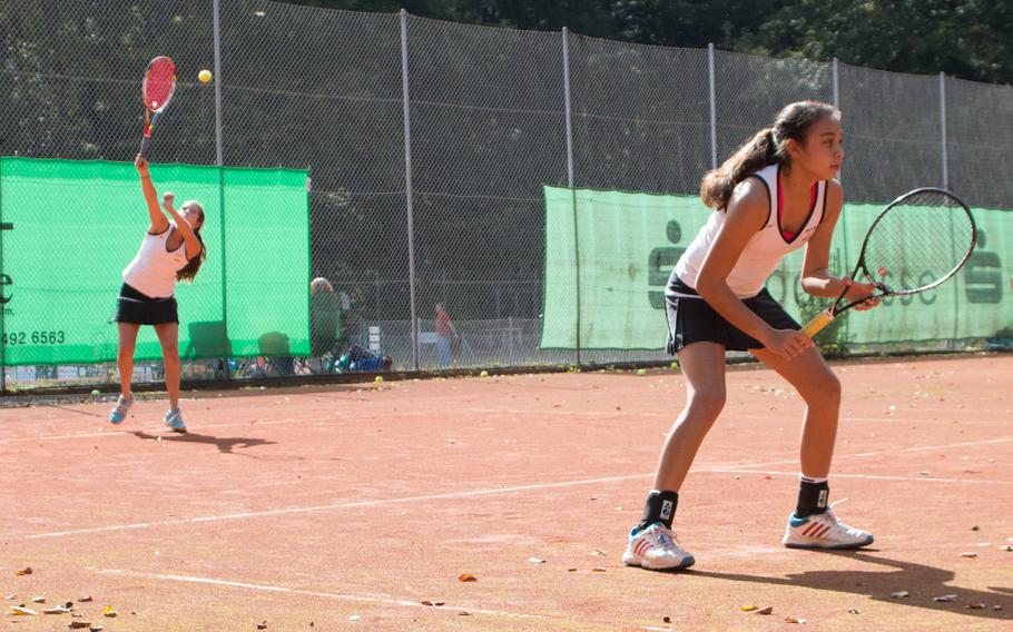 Patch's Marina Fortun and Marissa Encarnacion were perfect on that day, winning every single game in both singles and doubles play. Here, Fortun serves while Encarnacion holds the line during a match between the Panthers and the Hohenfels Tigers, Saturday, Sept. 27, 2014. 