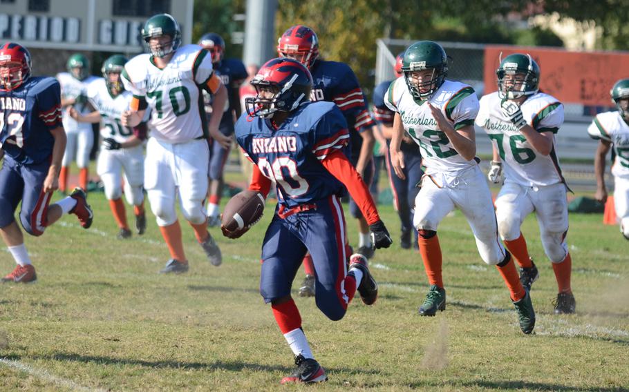 Aviano's Aaron Island breaks away from AFNORTH's defense Saturday during a football game at Aviano Air Base, Italy.