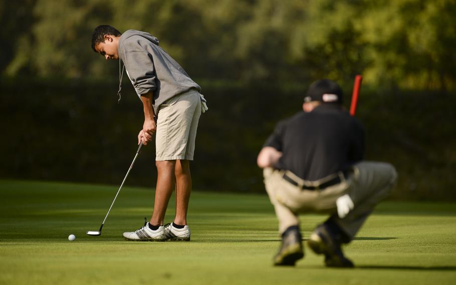 Wiesbaden's Jared Edwards putts Thursday, Oct. 2, 2014 during the last regular season DODDS-Europe golf tournament at the Rheinblick Golf Course in Wiesbaden, Germany.
