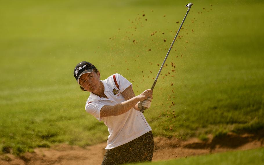 Kaiserslautern's Diana Myers chips out of a bunker Thursday, Oct. 2, 2014 during the last regular season DODDS-Europe golf tournament at the Rheinblick Golf Course in Wiesbaden, Germany.