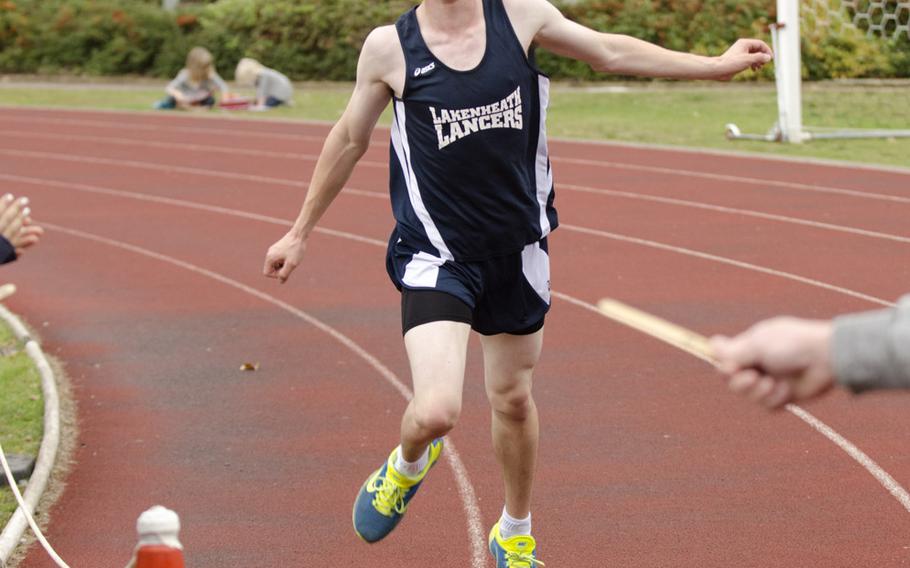 Lakenheath's Kyle Kerr finishes a cross-country meet at RAF Lakenheath, England, on Saturday, Oct. 4, 2014 against competitors from SHAPE and Menwith Hill. Kerr took first place with a time of 18 minutes, 20 seconds.