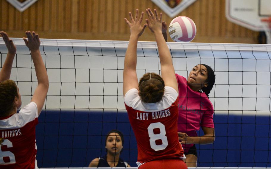 Lakenheath's Adrianna Ruffin spikes the ball Saturday, Oct. 4, 2014 as Kaiserslautern's Tia Hall tries to block during a volleyball match at Ramstein, Germany.