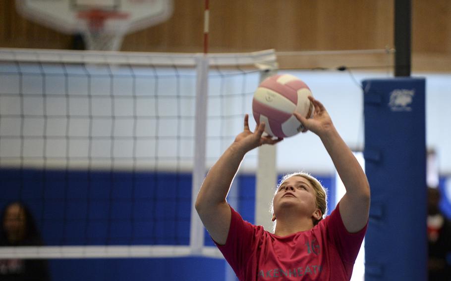 Lakenheath's Shannon Cox sets the ball Saturday, Oct. 4, 2014 during a volleyball match against Kaiserslautern at Ramstein, Germany.