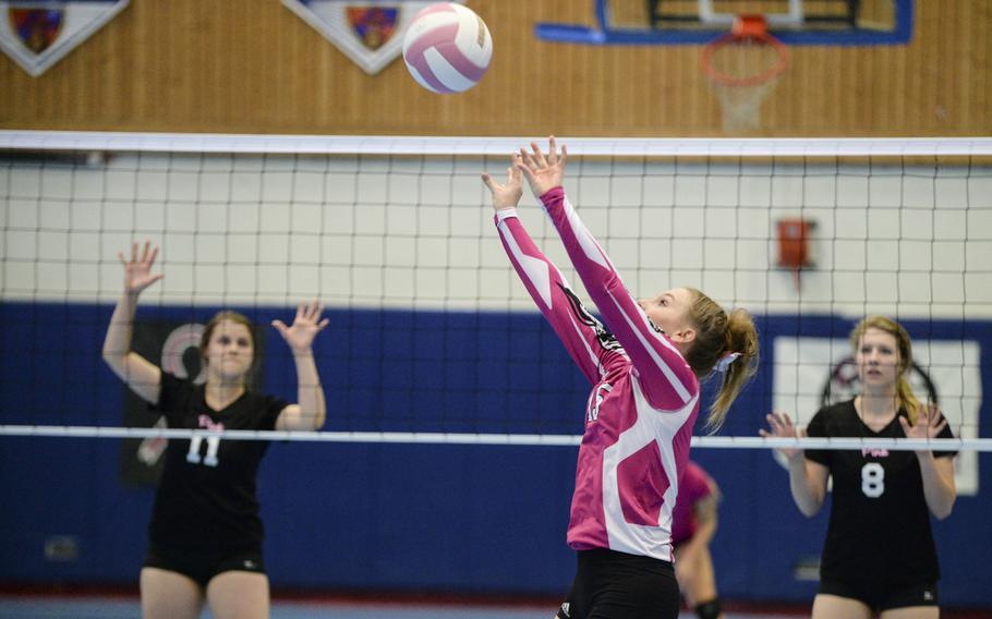 Vilseck's Lissy Hendrix sets the ball Saturday, Oct. 4, 2014 during a volleyball match against Ramstein at Ramstein, Germany.