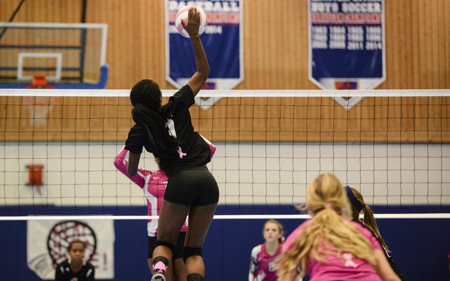 Ramstein's Danee Lawrence spikes the ball Saturday, Oct. 4, 2014 during a volleyball match against Vilseck at Ramstein, Germany.