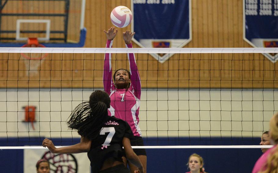 Vilseck's Alex Wise blocks Ramstein's Danee Lawrence Saturday, Oct. 4, 2014 during a volleyball match at Ramstein, Germany.