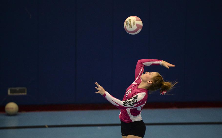 Vilseck's Lissy Hendrix serves the ball Saturday, Oct. 4, 2014 during a volleyball match against Ramstein at Ramstein, Germany.