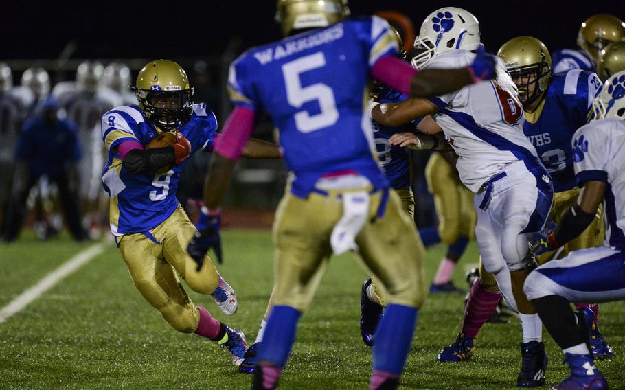 Wiesbaden's Deshon Barrow bounces around the end Friday, Oct. 10, 2014, at Wiesbaden, Germany. Wiesbaden went on to defeat Ramstein 20-14 in overtime.