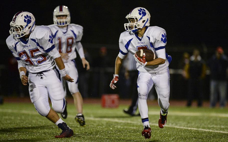 Ramstein's Gabriel Moreno carries the ball Friday night at Wiesbaden, Germany. Wiesbaden went on to win 20-14 in overtime.