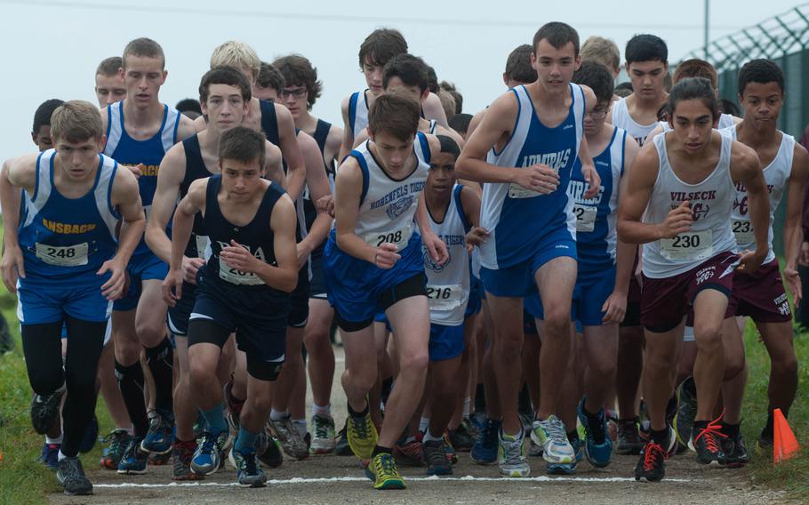 Ansbach hosted a five school cross-country meet, Oct. 11, 2014. Here the boys take off for the 5k run that Black Forest Academy's Jacob Benjamin won with a time of 17 minutes, 52.23 seconds.