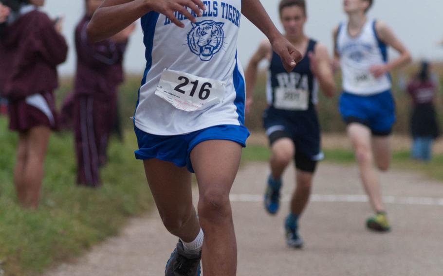 Jeremias Serrao-Velez, a junior varisty runner for Hohenfels, crosses the finish line during a cross-country 5k in Ansbach, Germany on Oct. 11, 2014. Serrao-Velez finished with a time of 17 minutes, 50.30 seconds.