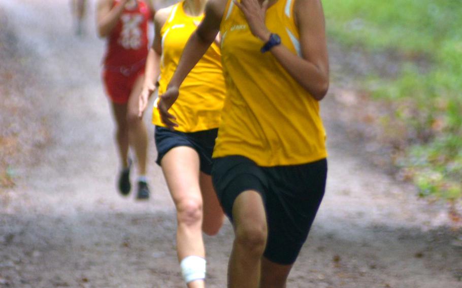 Patch's Michelle Gelacio runs in for a 21 minutes, 26 seconds, first place win Saturday at a DODDS-Europe cross country meet in Wiesbaden, Germany.  On Gelacio's heels is teammate Gabby Gante, who placed second with 21:27 and Kaiserslautern's Megan Mackie, placing third with 21:33.