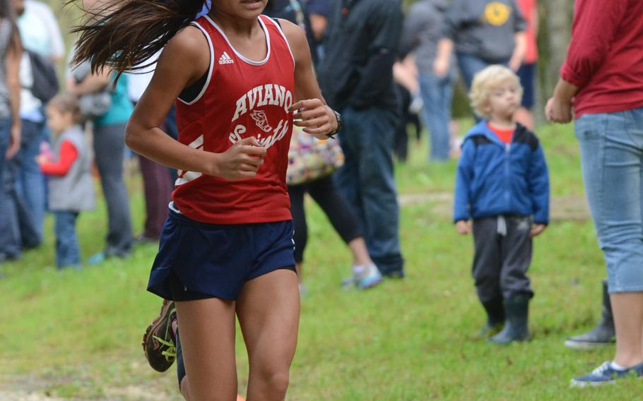 Aviano's Ginny Belt took first place for the girls Saturday during a cross country meet against Vicenza at San Giovanni, Italy, with a time of 23 minutes, 51 seconds.
