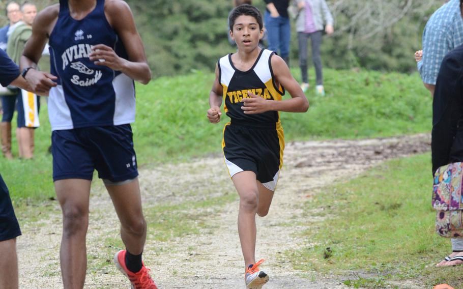 Vicenza's Caleb Robles crosses the finish line on the heels of Aviano's Jaylen Esposito during a cross country meet at San Giovanni, Italy. Robles finished in 20 minutes, 48 seconds.