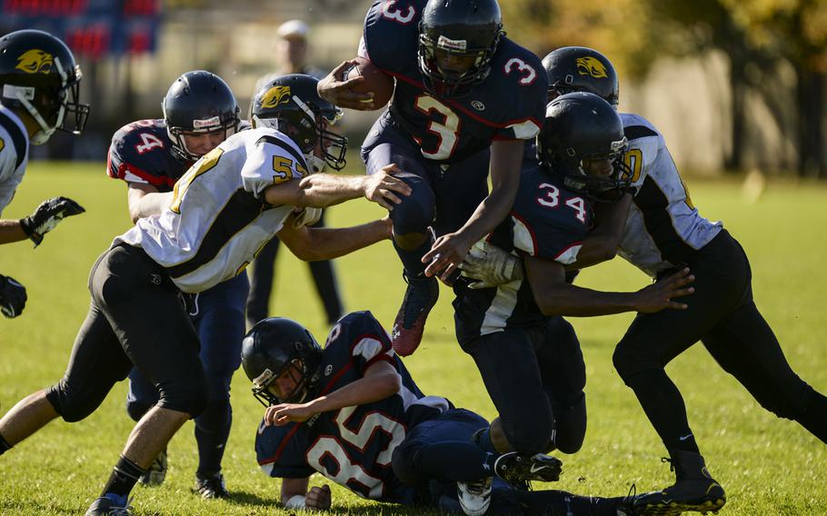 Bitburg's Curtiss Wilson picks up a few yards against Vicenza on Saturday, Oct. 18, 2014, at Bitburg, Germany.