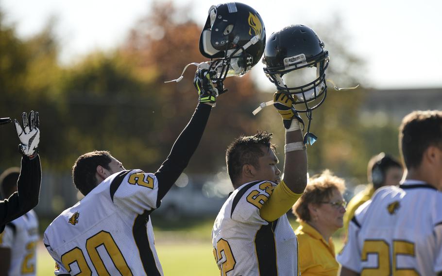 Vicenza's Kristian Rodriquez, left, and Bezzy Calunggay celebrate after their team scored the game winning extra point Saturday, Oct. 18, 2014, at Bitburg, Germany.