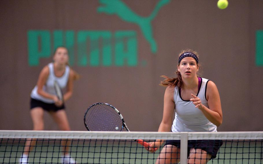 Vicenza's Kiki Sibilla, right, watches her shot sail over the net in a semifinal match at the DODDS-Europe tennis championships in Wiesbaden, Germany, Friday Oct. 24, 2014. Sibilla and teammate Katleen Leosk lost the match 6-4, 6-4 and will face AFNORTH in Saturday's third place match.