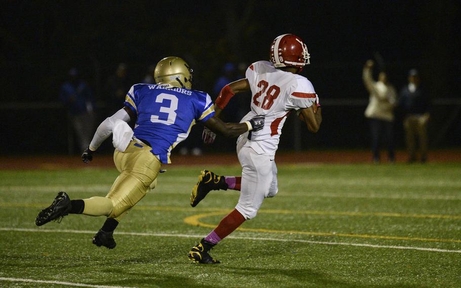 Wiesbaden's Paul Blackwood makes a one-handed tackle on Kaiserslautern's Jamarcus Myles to prevent a touchdown Friday, Oct. 24, 2014, at Wiesbaden, Germany.