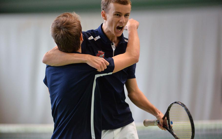 ISB's Maxime Dumortier, right, celebrates with teammate Bram den Dekker after defeating Patch's Peyton Fritz and Devin Rehwaldt 7-5, 6-7 (5-7), 7-5 in the boys doubles final at the DODDS-Europe tennis championships in Wiesbaden, Germany, Saturday, Oct. 25, 2014.