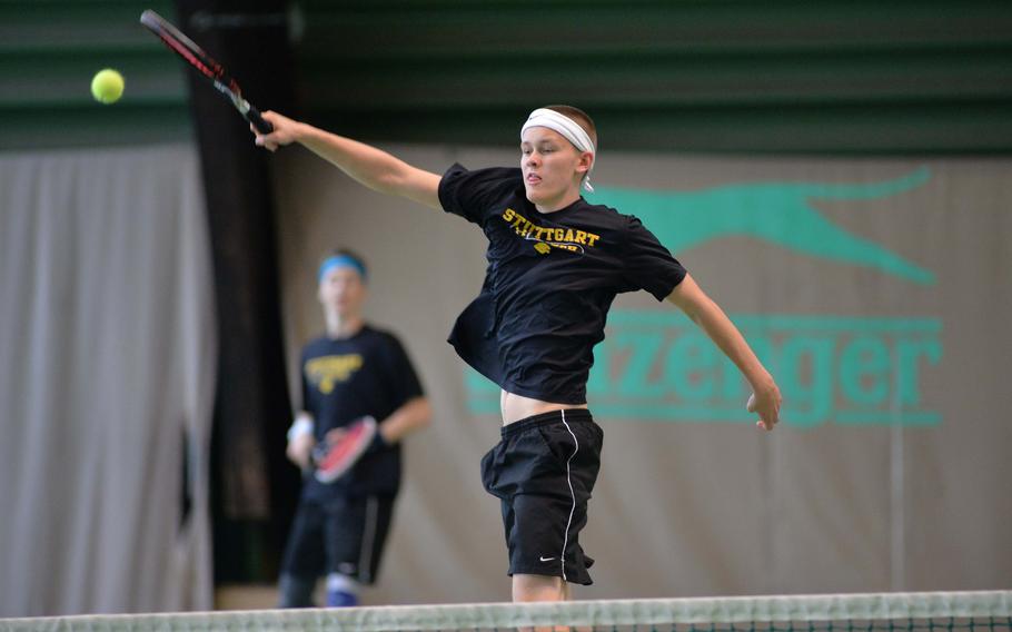 Patch's Devin Rehwaldt slams the ball over the net as teammate Payton Fritz watches in the boys doubles final at the DODDS-Europe tennis championships in Wiesbaden, Germany, Saturday, Oct. 25, 2014. The Patch duo fell to ISB's Bram den Dekker and Maxime Dumortier 7-5, 6-7 (5-7), 7-5.