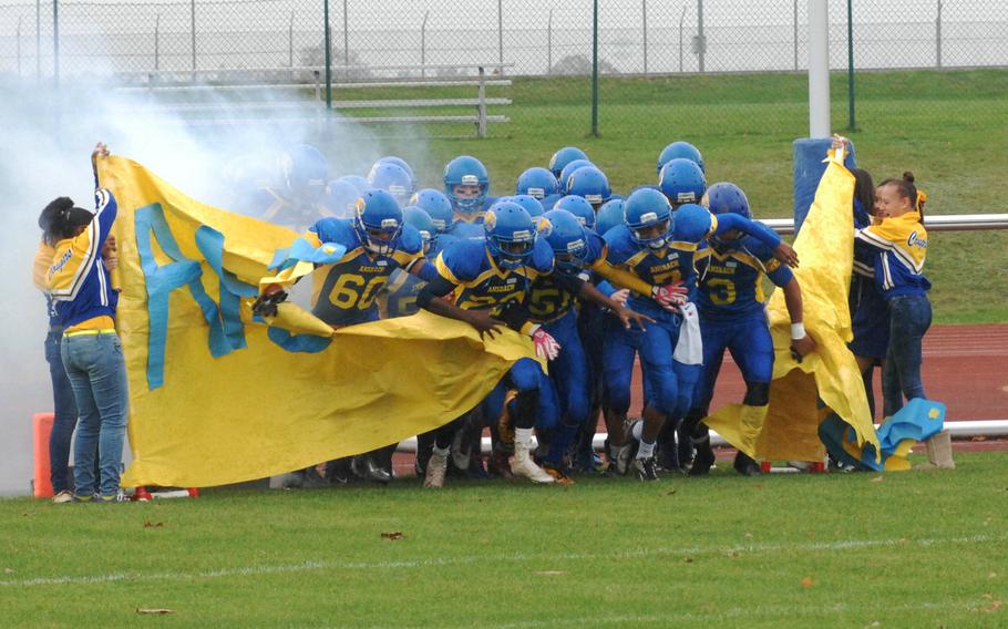 The Ansbach Cougars enter the field Saturday at Gray Stadium in Ansbach, Germany. Ansbach advanced to the DODDS-Europe Division II championship game with a 32-12 victory.