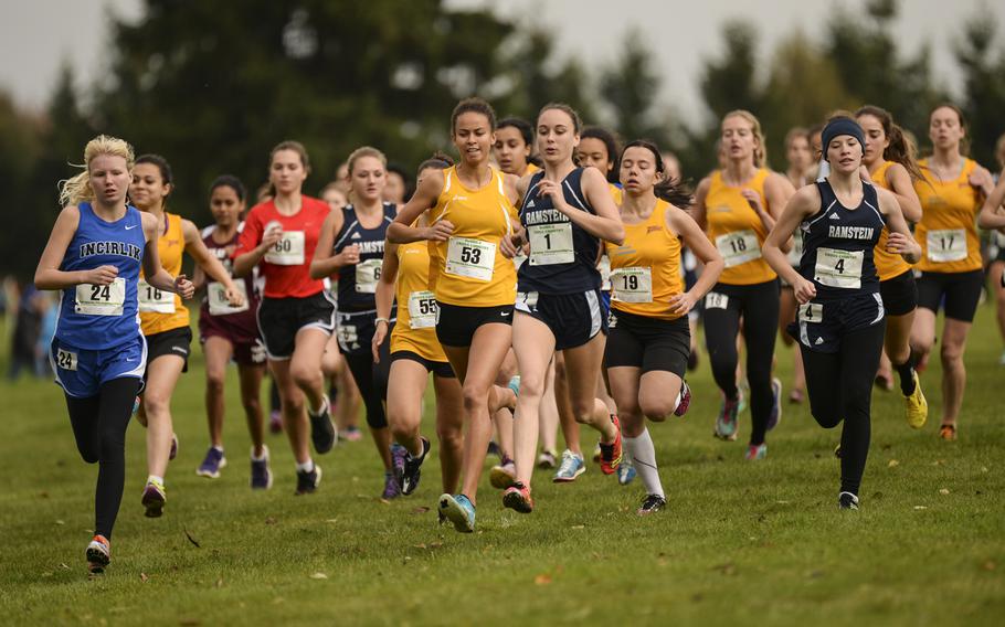 Racers sprint at the start of the DODDS-Europe cross country championship race at the Rolling Hills Golf Club in Baumholder, Germany, Saturday, Oct. 25, 2014.