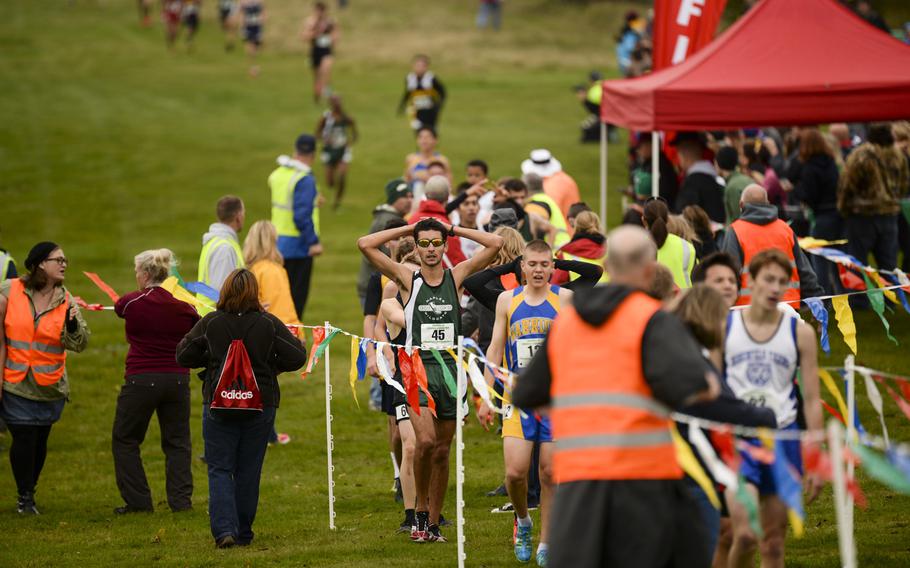 Competitors finish the DODDS-Europe cross country championship race at the Rolling Hills Golf Club in Baumholder, Germany, Saturday, Oct. 25, 2014.