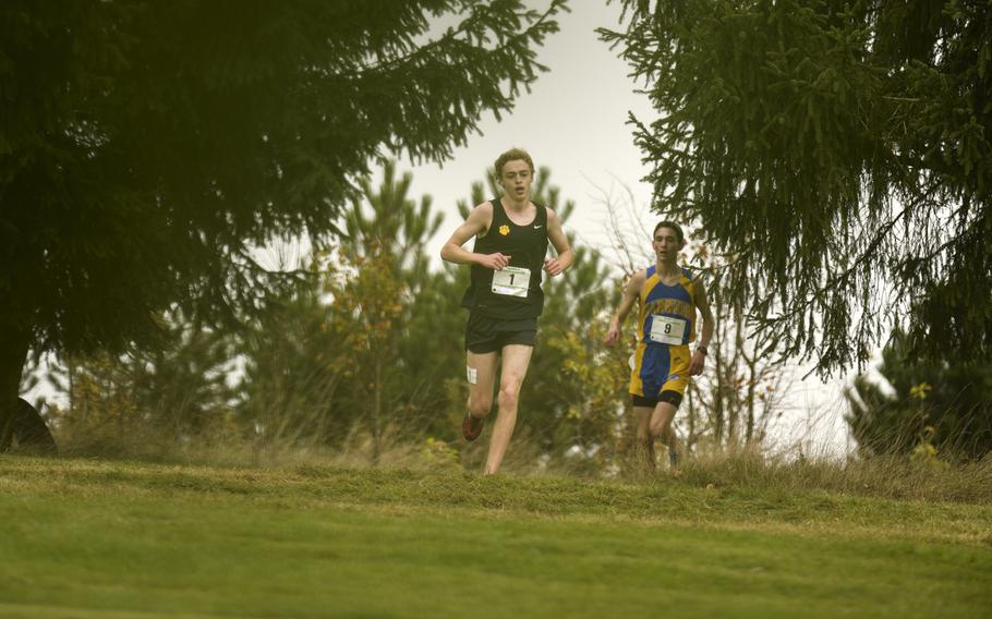 Patch's Mitchell Bailey leads the DODDS-Europe cross country championship race just ahead of Wiesbaden's Ryan Parker at the Rolling Hills Golf Club in Baumholder, Germany, Saturday, Oct. 25, 2014.
