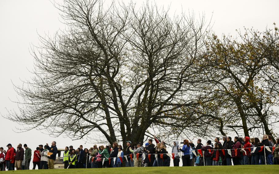 Spectators line up to watch the start of the DODDS-Europe cross country championship race at the Rolling Hills Golf Club in Baumholder, Germany, Saturday, Oct. 25, 2014.