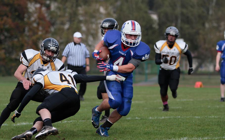 Ramstein's Ben Ciero breaks a tackle on the way to his first touchdown in the Royals' 48-7 romp Saturday, Oct. 25, 2014, in their DODDS-Europe semifinal against visiting Patch.